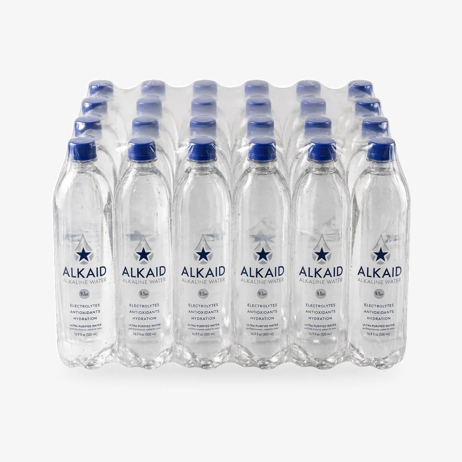 A 24-pack of 16oz alkaline water bottles in a clear plastic wrap carrier, showing the front labels and blue caps with Alkaid branding against a white background.